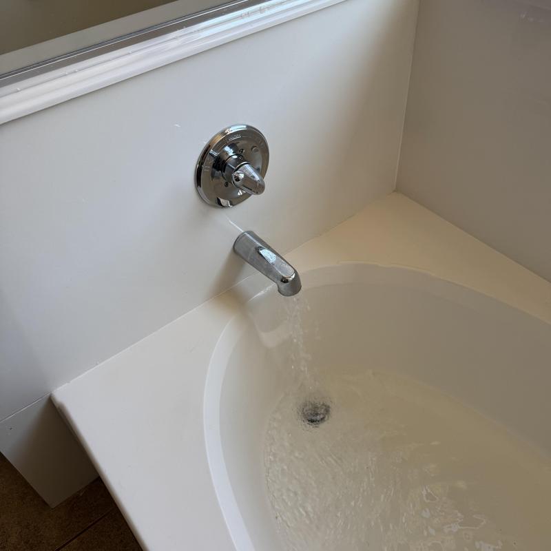 Roman tub faucet and valve flowing water for leak test