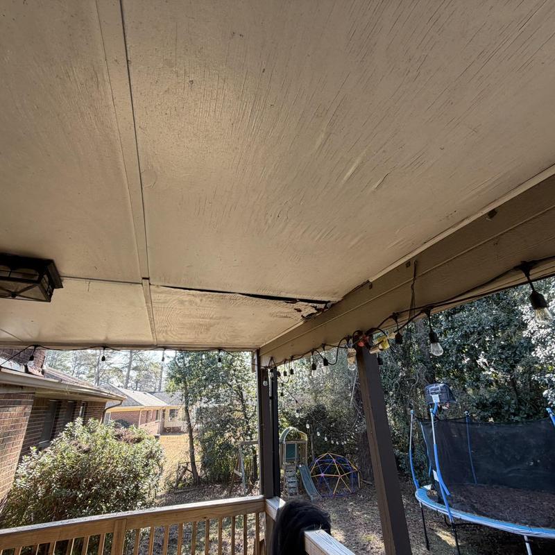 Porch ceiling plywood and trim with damage