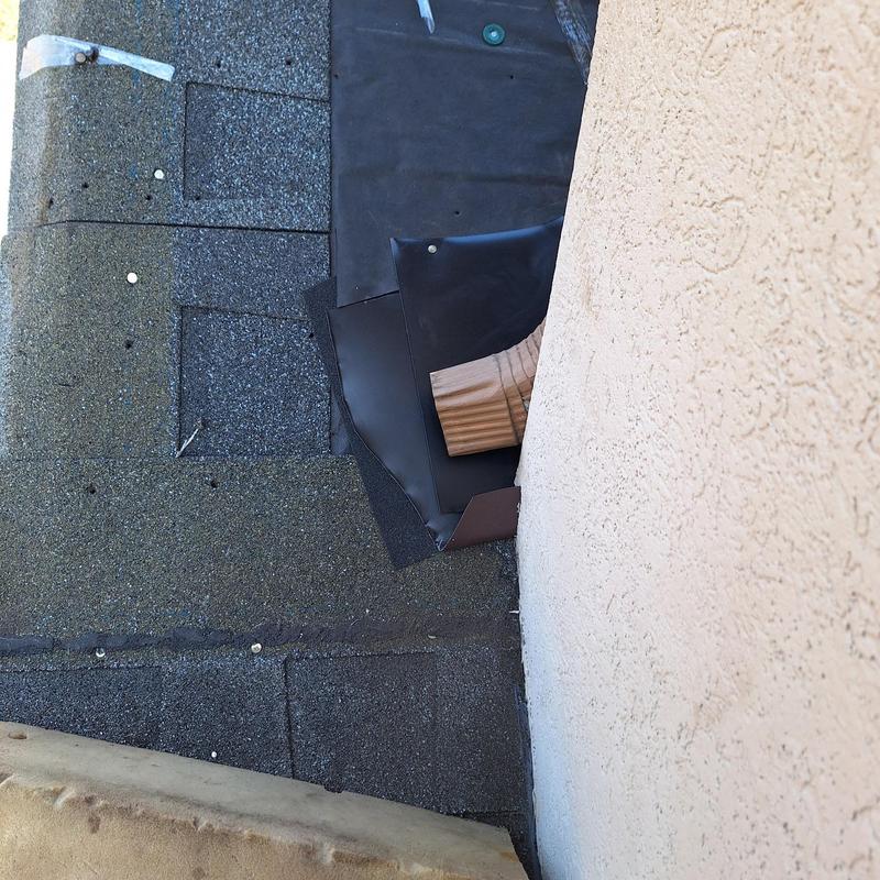 Roof flashing and shingle replacement near stucco wall