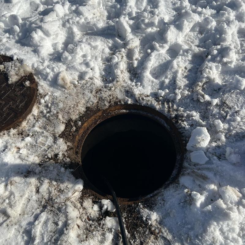 Sewer pipe ice clog removal in snowy ground