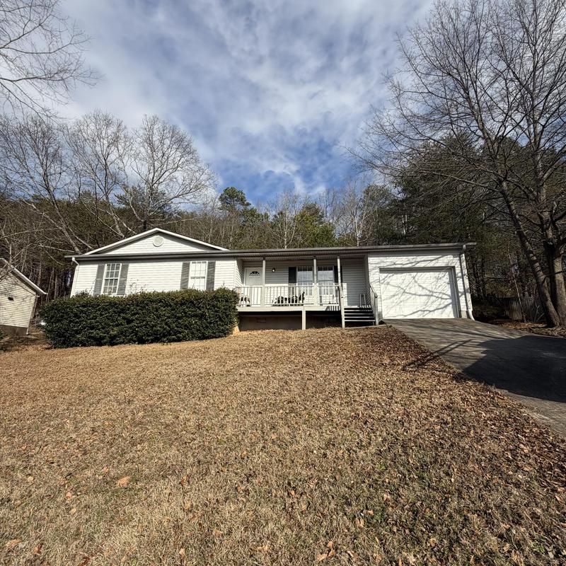 3-tab roof with missing shingles and damaged gutters