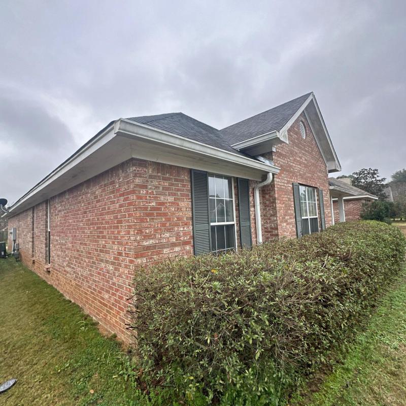 Asphalt shingle roof installation on brick house Asphalt shingle roof installation on brick house