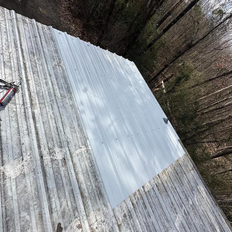 Metal roof panels with new section installed Metal roof panels with new section installed