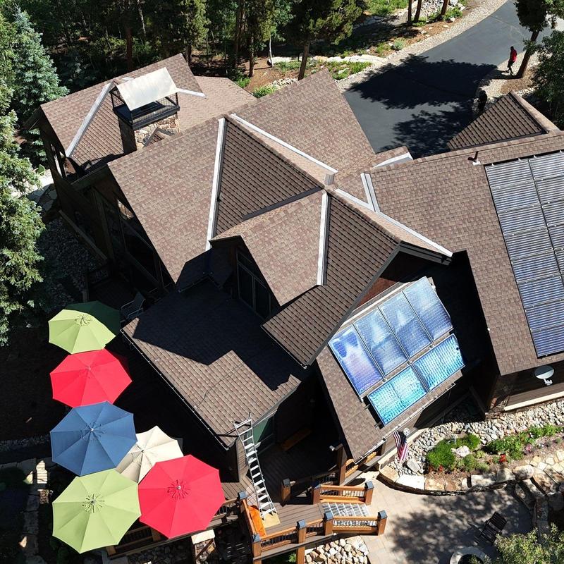 Solar panel and heat tape on asphalt shingle roof