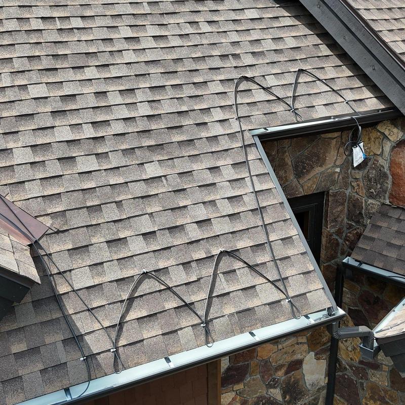 Heat tape system installation on asphalt shingle roof