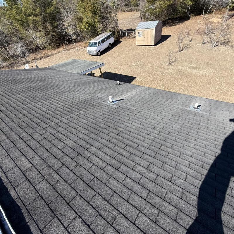 Asphalt shingle roof with vent pipes and clear decking