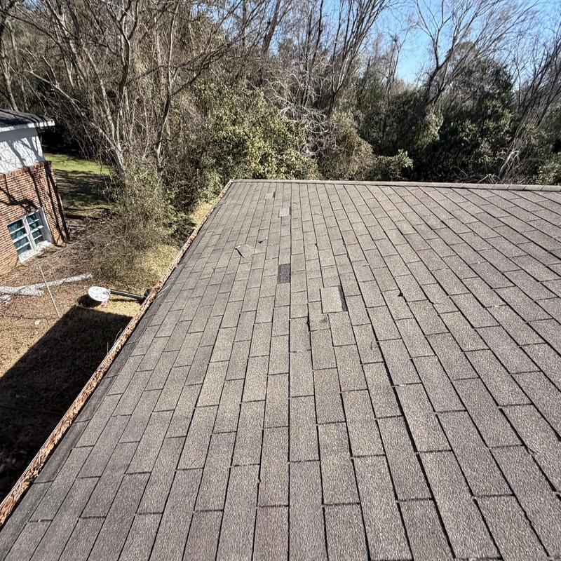 Asphalt shingle roof with damaged wood fascia and gutters