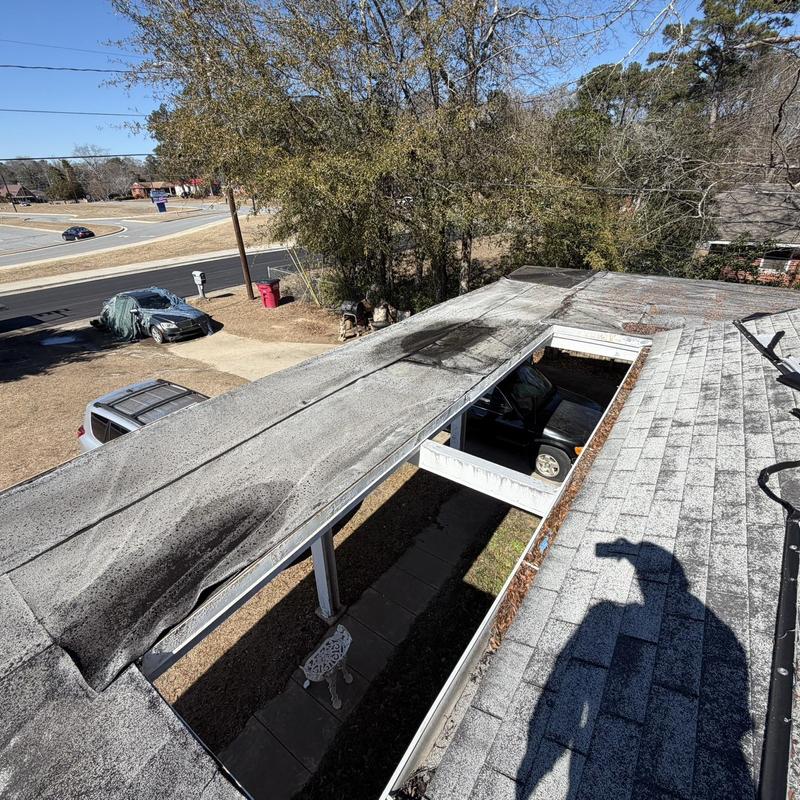 Flat roof decking with extensive rot and damage
