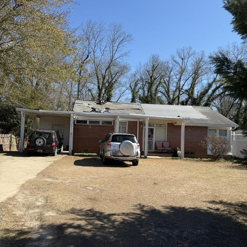 Flat roof framing and decking rot on one-story house