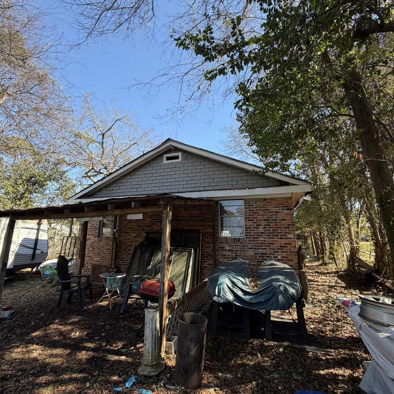 Wood fascia and soffit replacement on brick house exterior