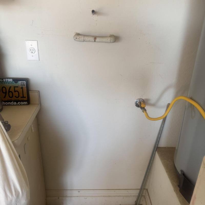 Water softener installation plumbing setup in laundry area