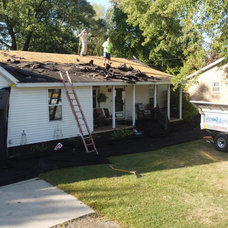 Roof asphalt shingle tear off and deck exposure in progress