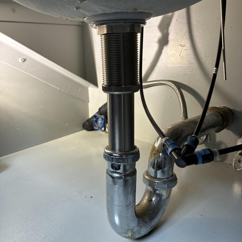 Pop-up drain and P-trap under kitchen sink installation