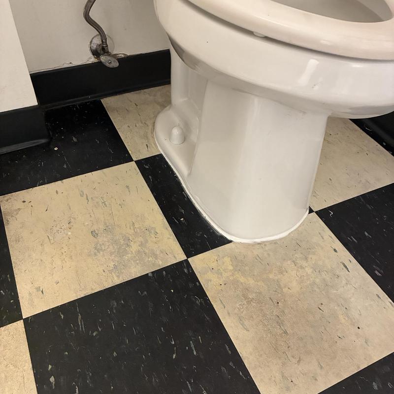 Toilet base with replaced wax ring and bolts