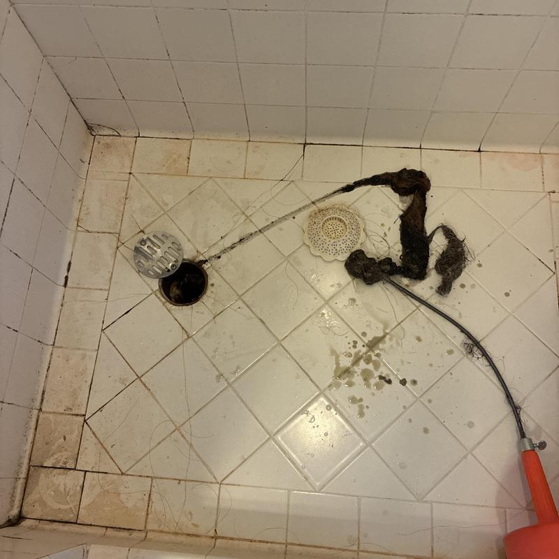Shower drain clog removal with hair blockage in shower