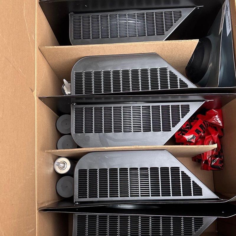 HVAC unit air filters stacked inside a cardboard box