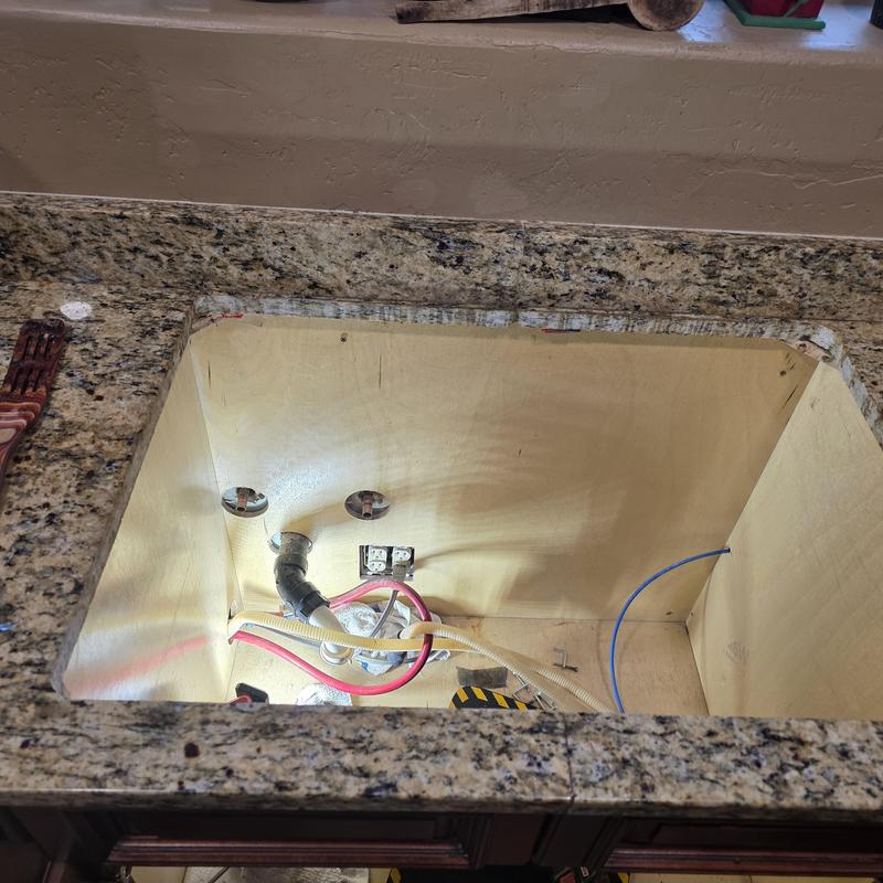 Kitchen sink cutout with plumbing and electrical rough-in