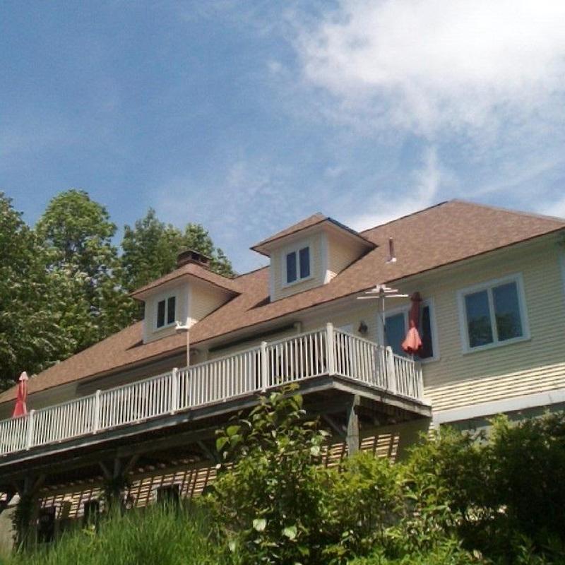 Asphalt shingle roof on residential home with deck