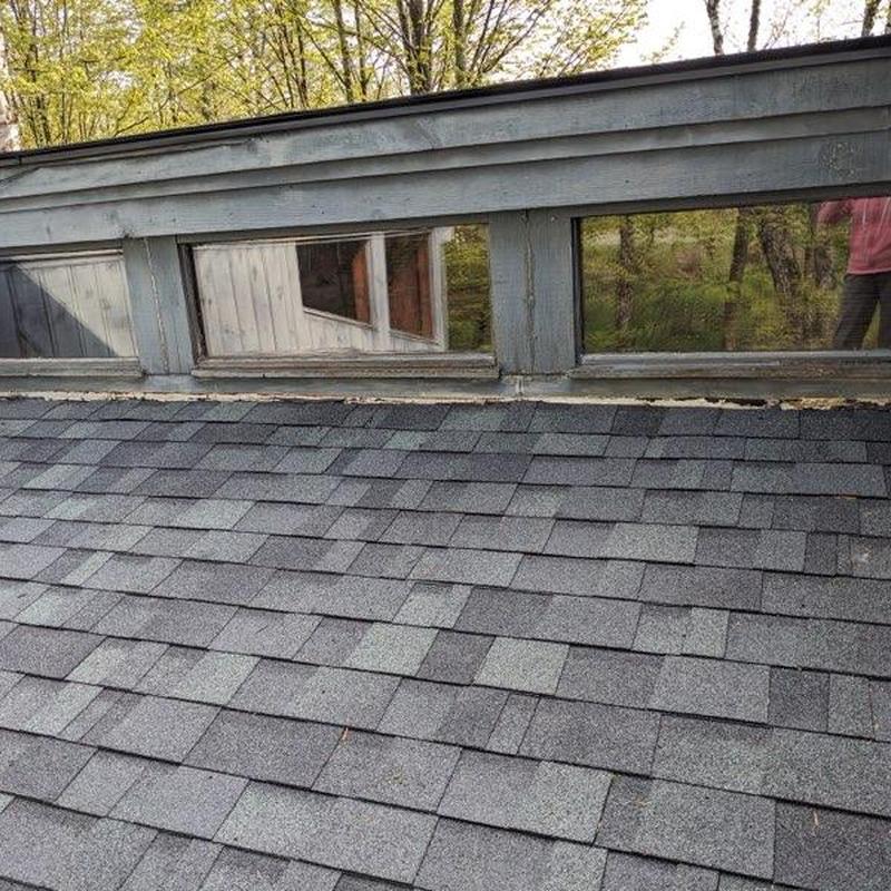 Asphalt shingle roof with dormer window trim