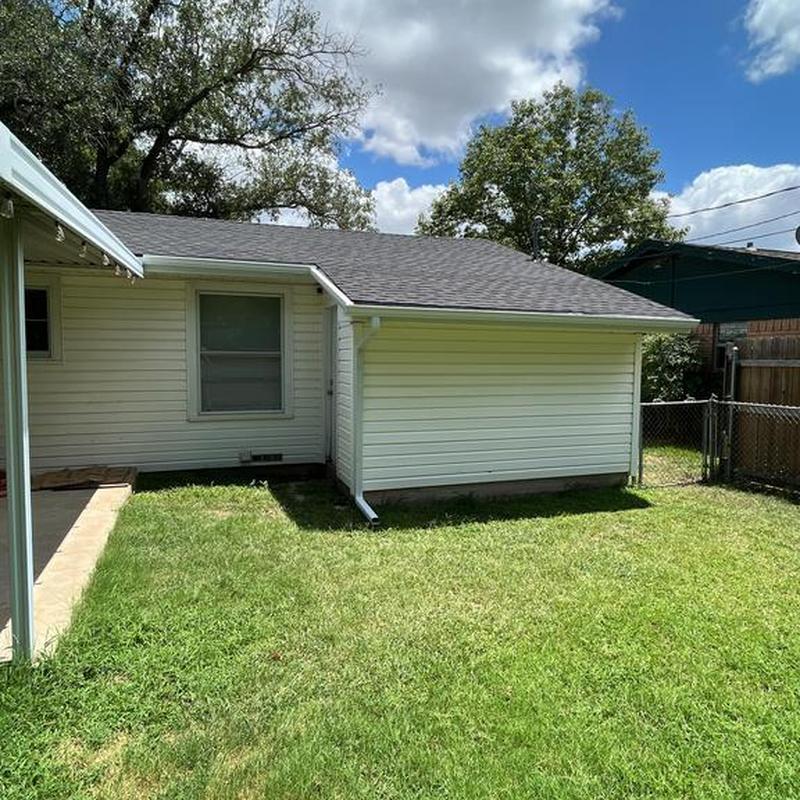 5-inch seamless gutters with guards on house exterior