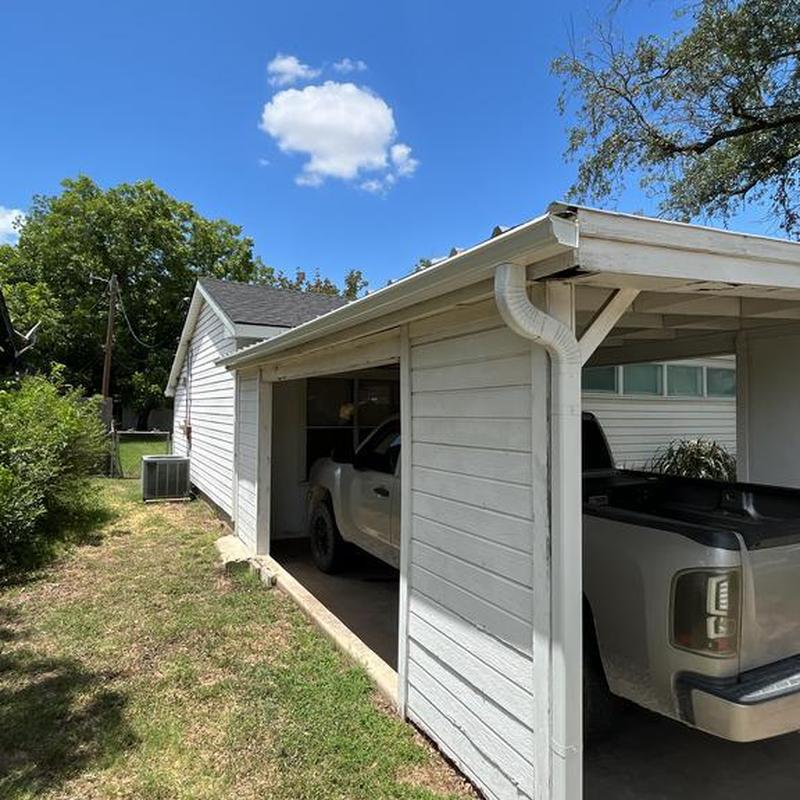 5-inch seamless gutter with guards on carport roof