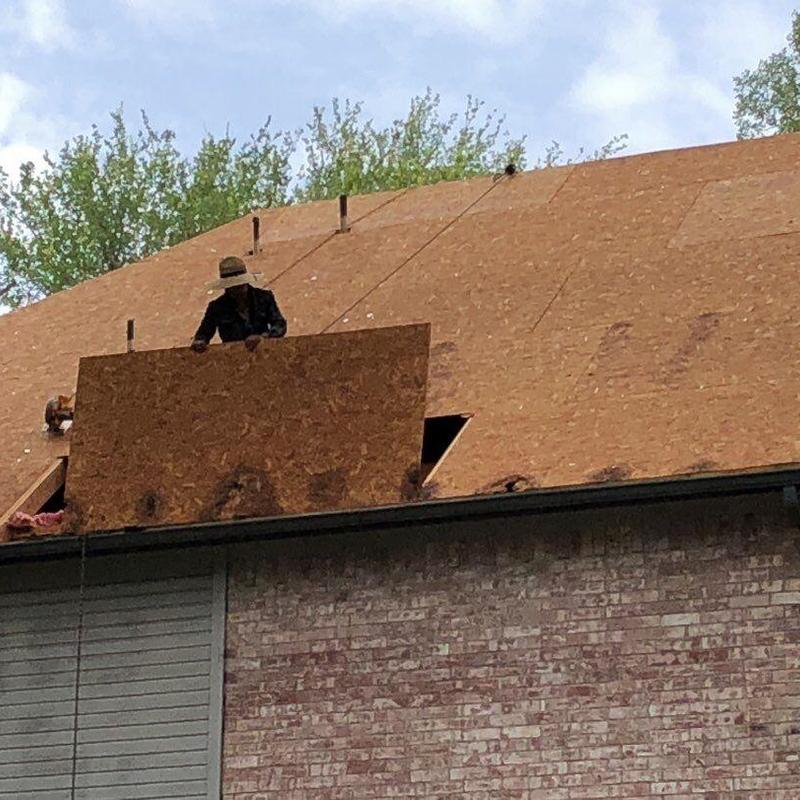 Roof decking replacement on pitched residential roof