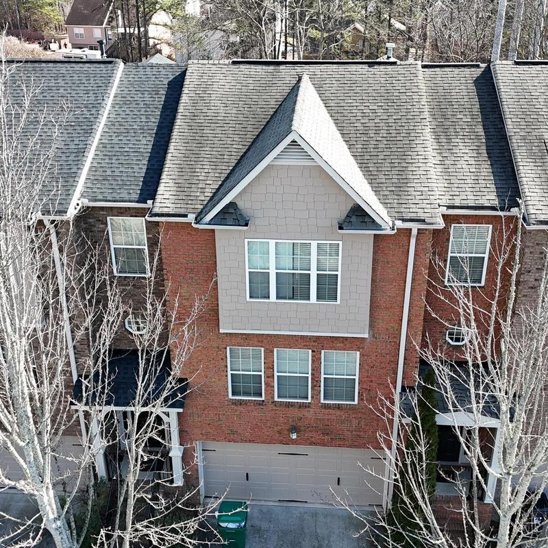 Roof shingles and mechanical sealant inspection on townhouse roof