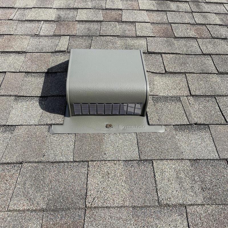 Metal roof vent with integrated flashing on shingle roof