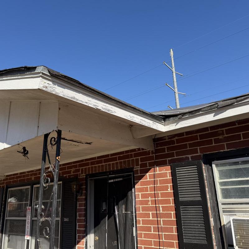 Fascia and soffit with visible wood rot and damage