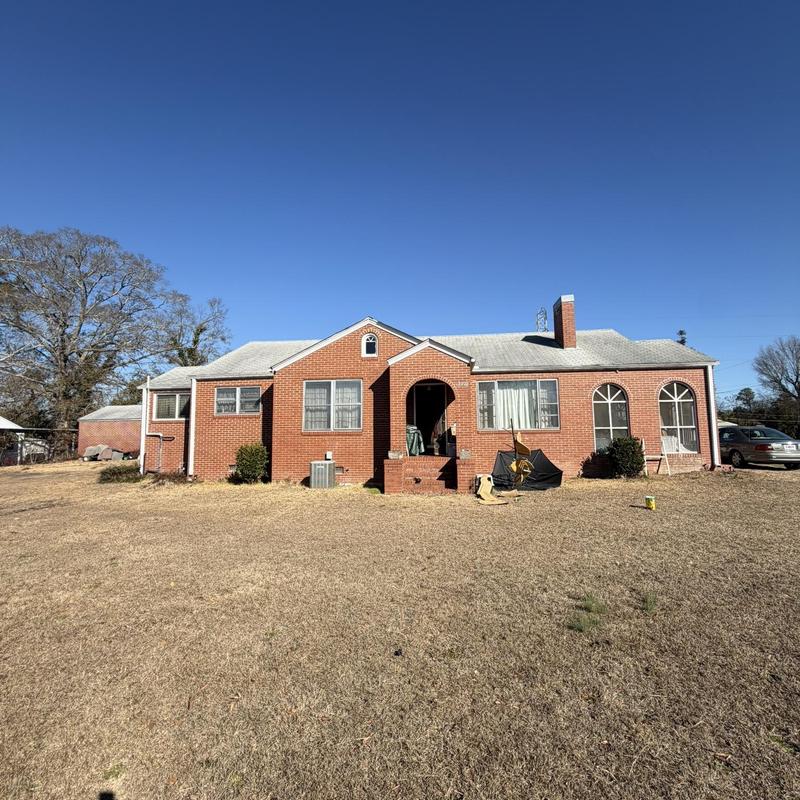 Roofing system on one-story brick house with full replacement needed