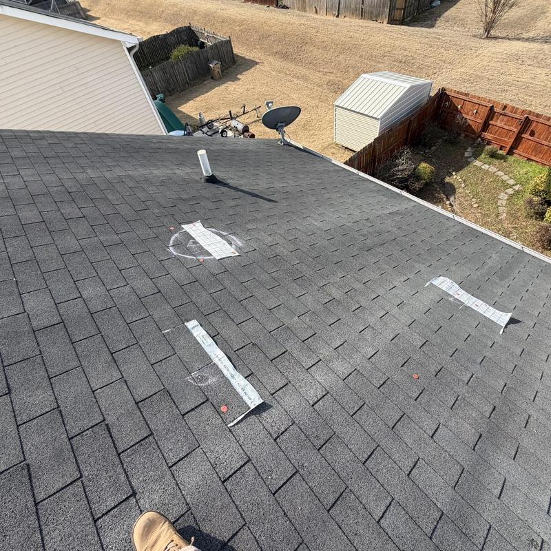 Asphalt shingles with repair markings and patches