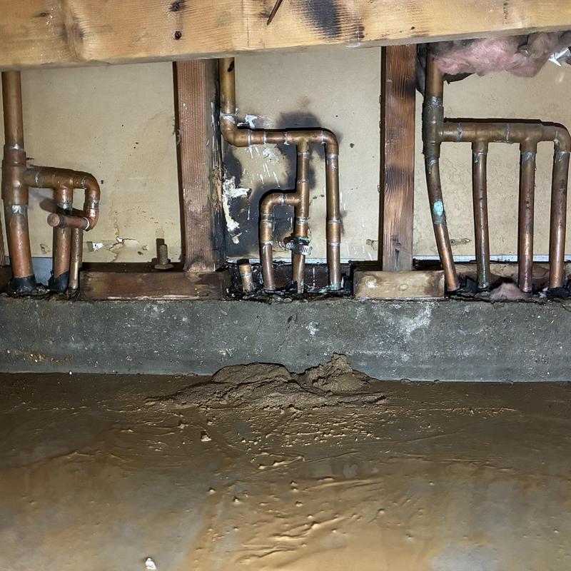 Copper plumbing pipes with burn and water damage in wall cavity Copper plumbing pipes with burn and water damage in wall cavity