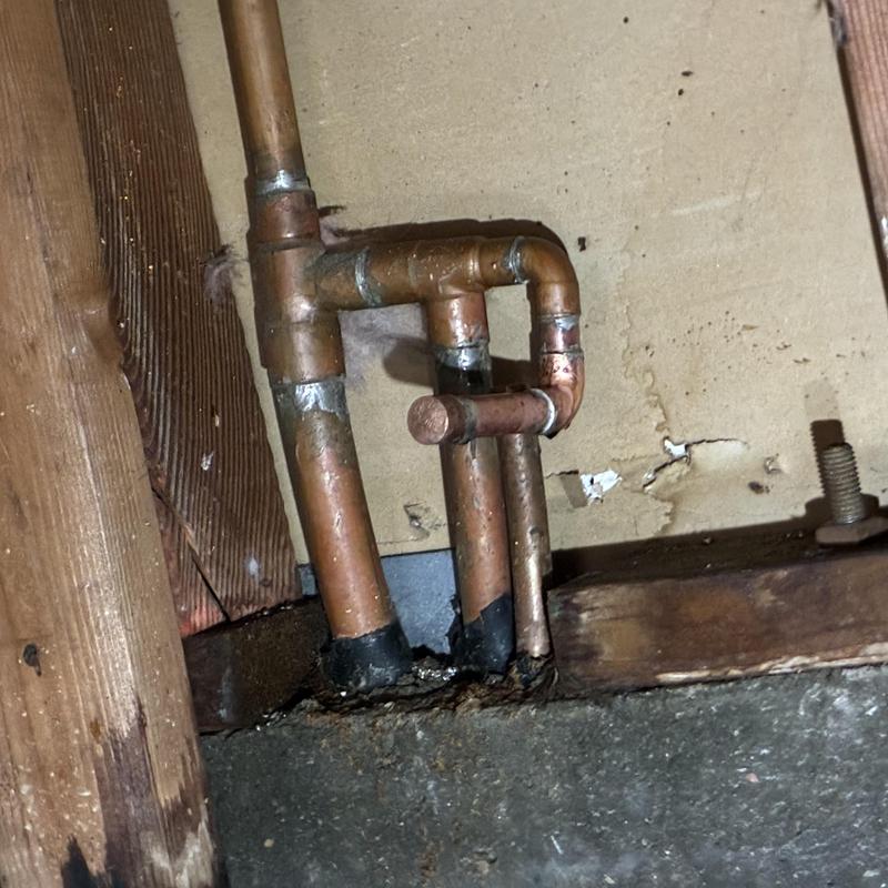 Copper water heater pipes with leak and reroute repair Copper water heater pipes with leak and reroute repair