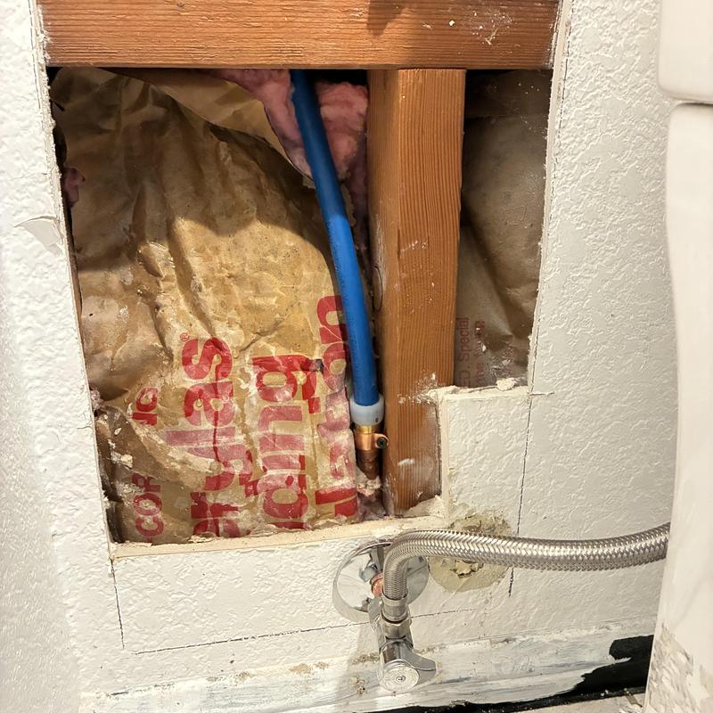 Hot water line reroute behind bathroom wall Hot water line reroute behind bathroom wall