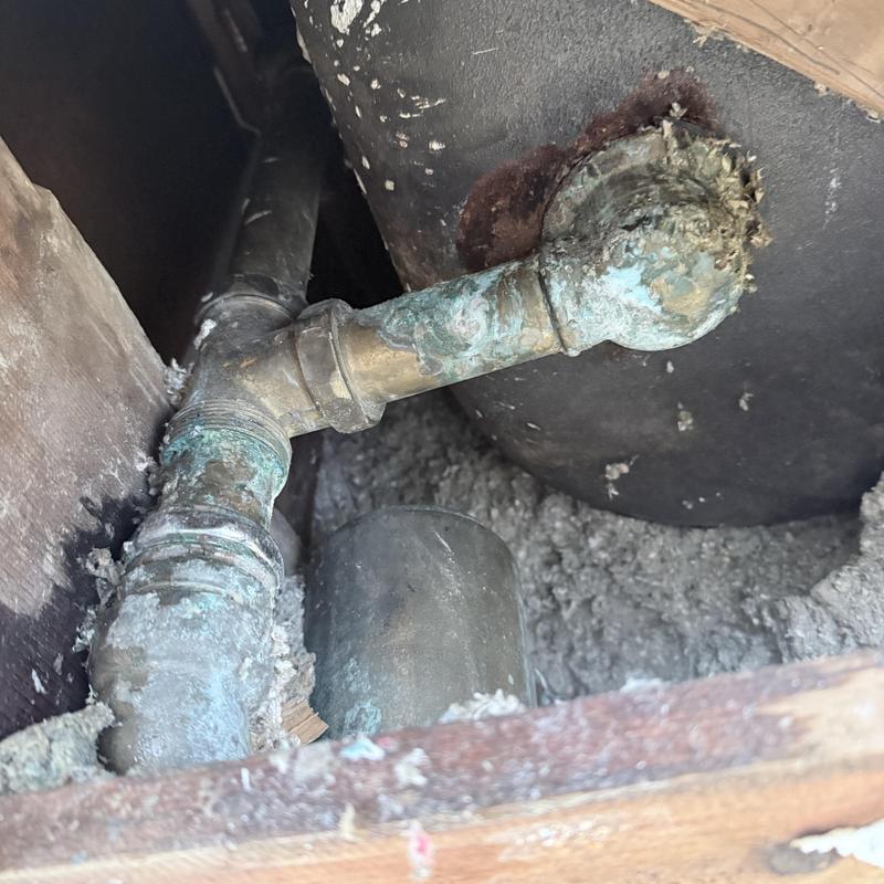 Tub drain pipe with corrosion inside ceiling cavity Tub drain pipe with corrosion inside ceiling cavity