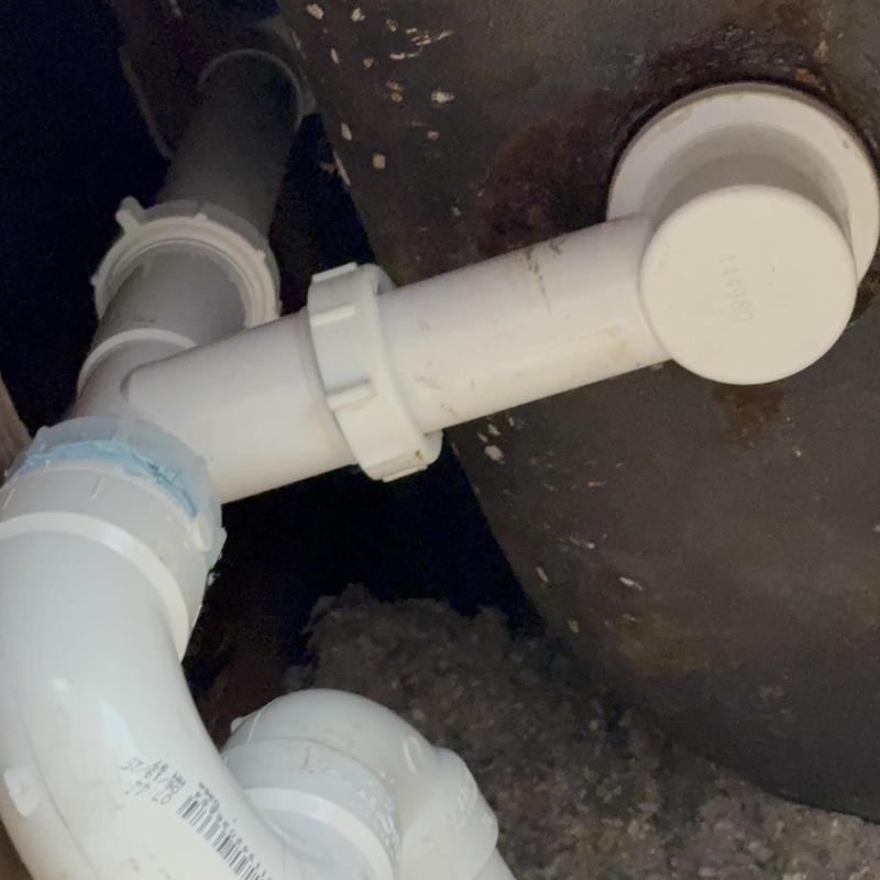 Tub drain PVC piping installation under ceiling view Tub drain PVC piping installation under ceiling view