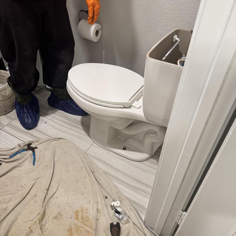 Toilet wax seal replacement with tools and drop cloth
