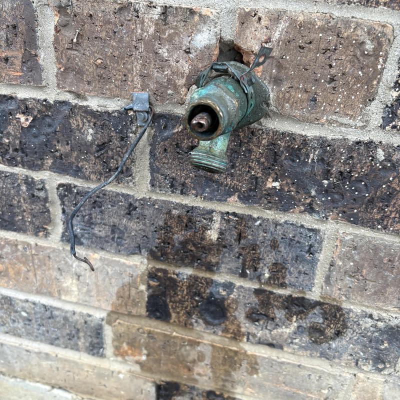 Hose bib replacement on outdoor brick wall