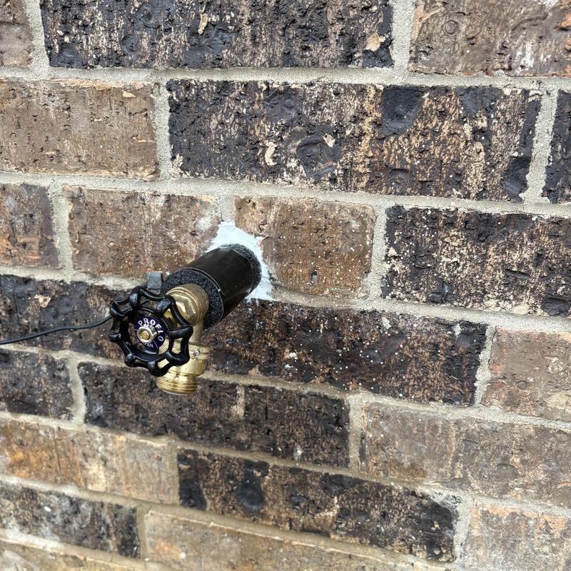 Hose bib wall mount with new caulking seal