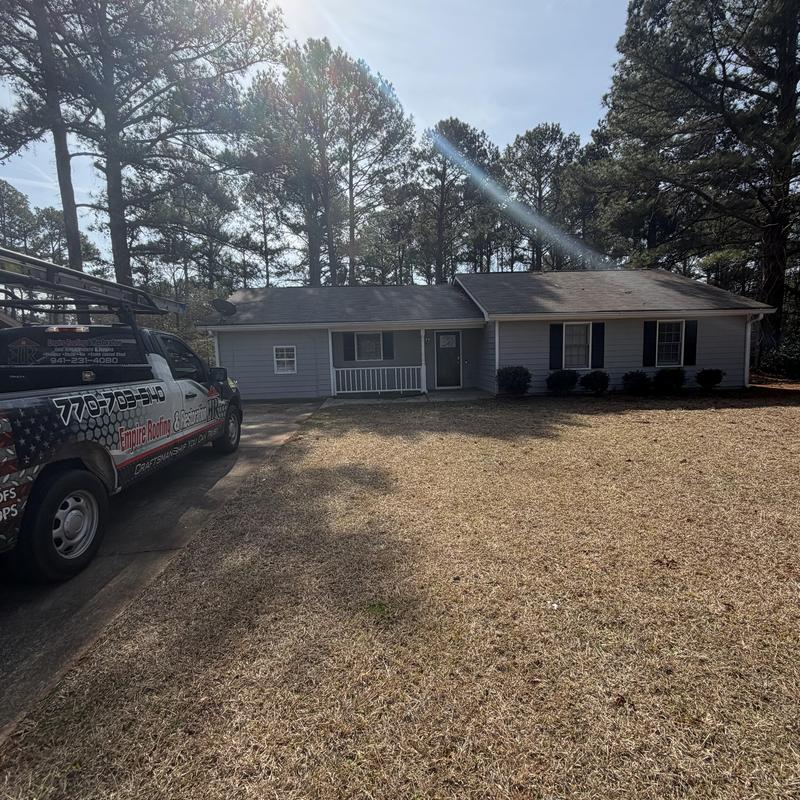 Roof with damaged fascia and soffit near chimney