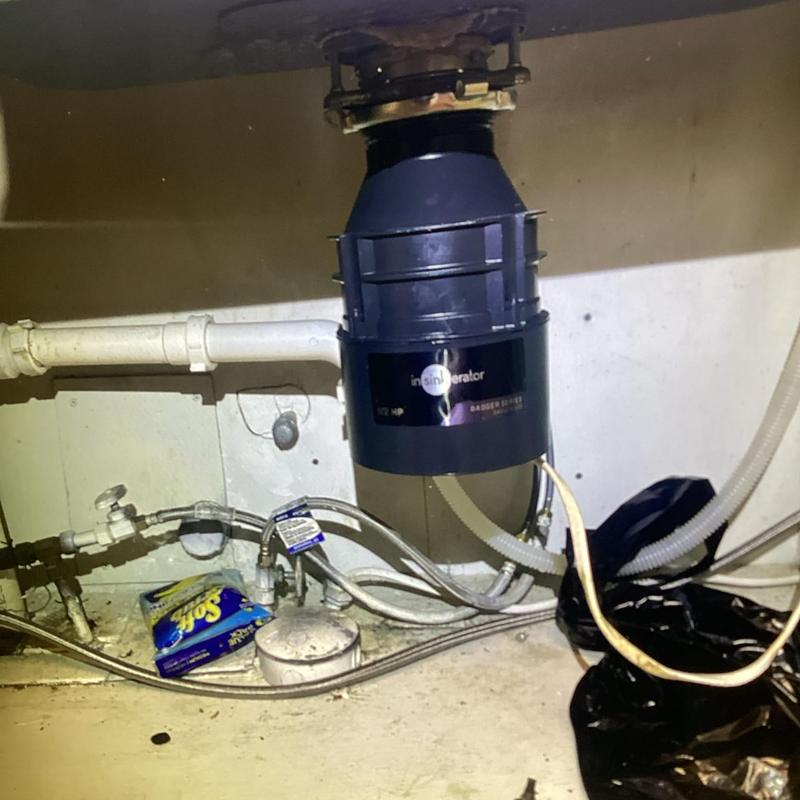 Garbage disposal installation under kitchen sink