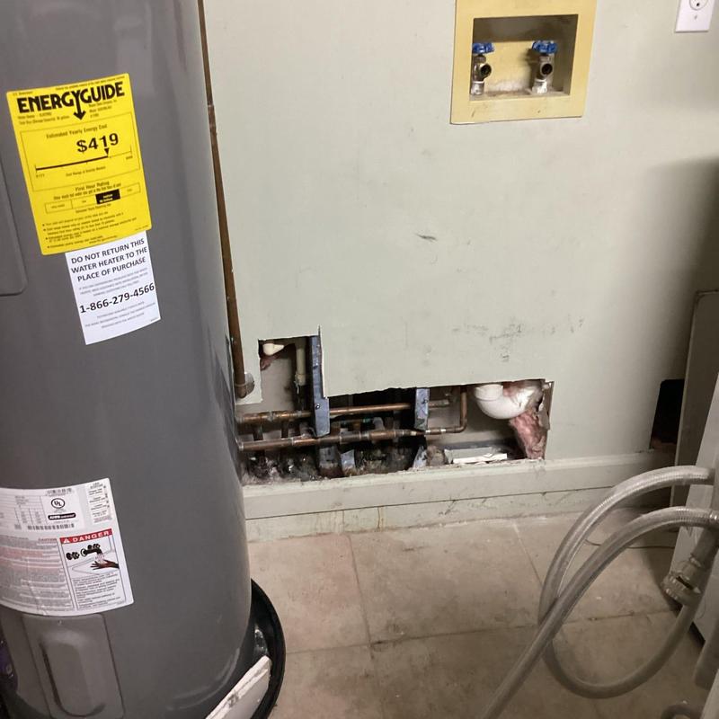 Cold water supply line with overhead loop in wall cutout