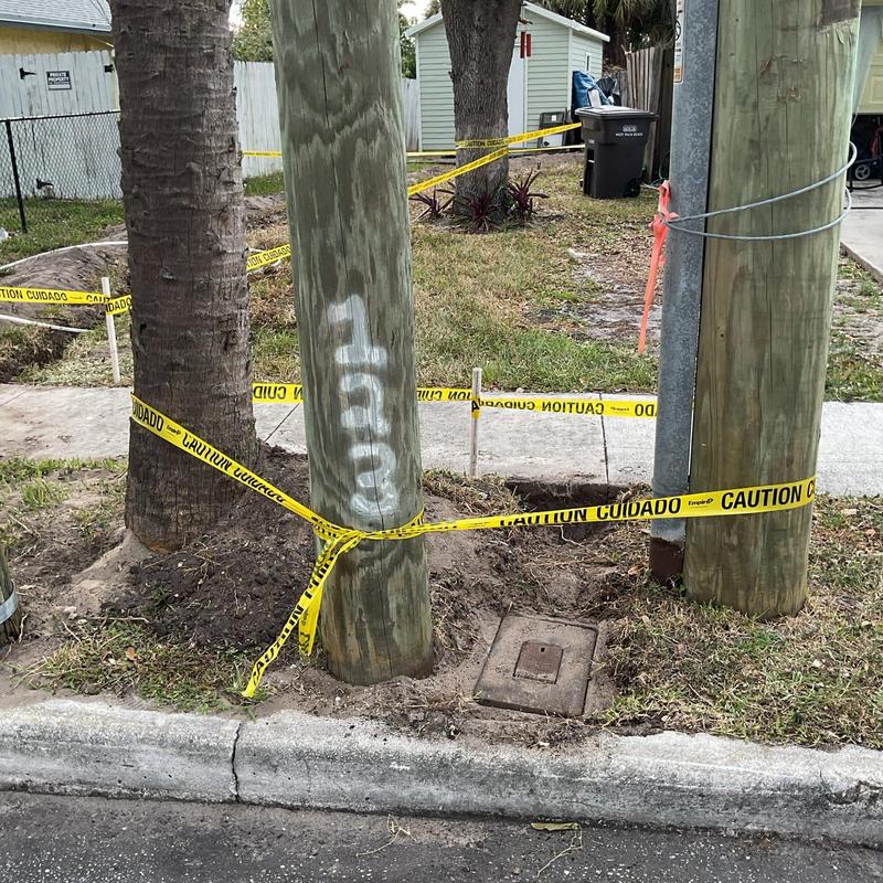 Main service water line installation with caution tape