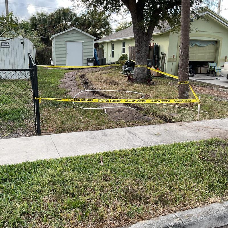 Uponor Pex water line trench with caution tape