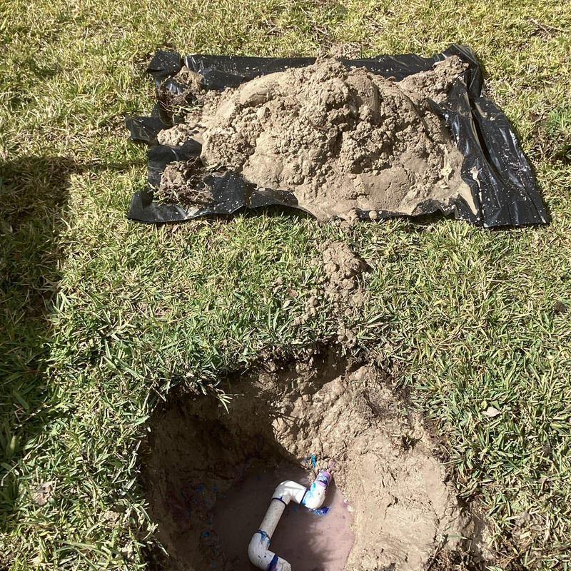 Water meter pipe with PVC joint in ground hole