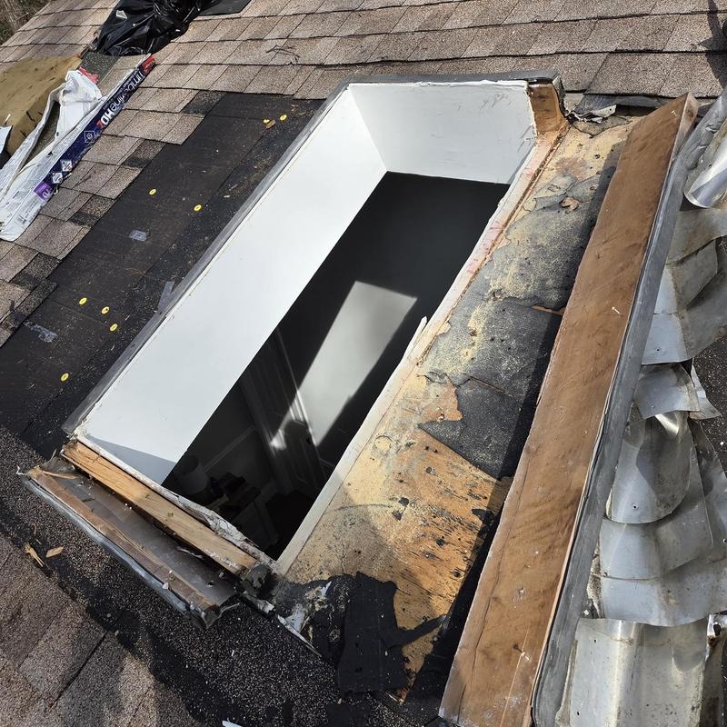 Skylight frame and damaged roof decking removal