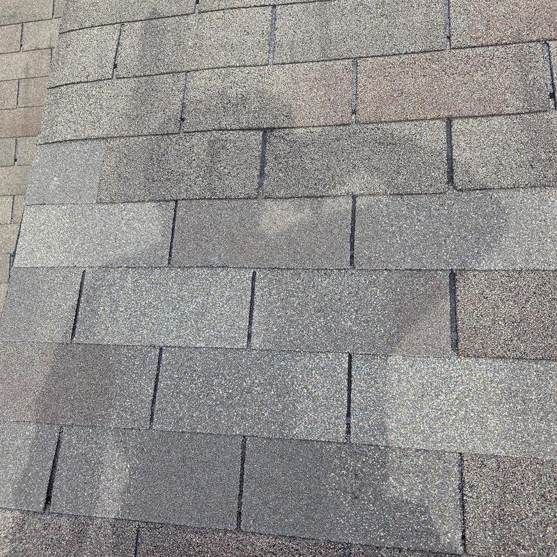 Asphalt roof shingles with new caulking and replacement