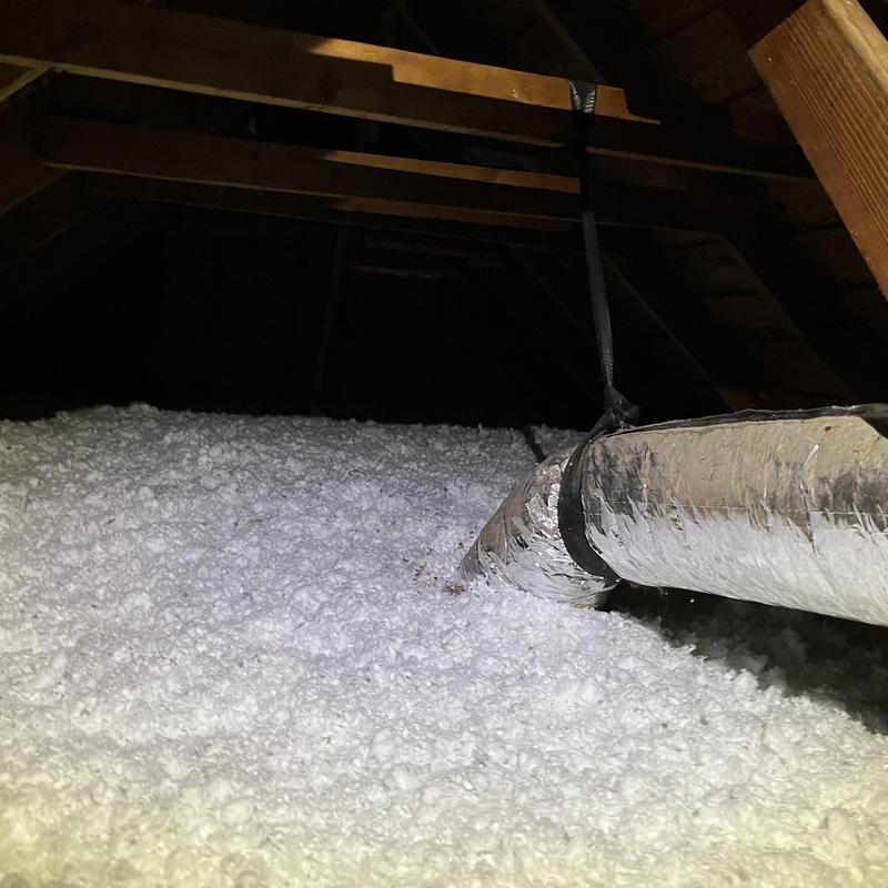 Attic loose-fill insulation with ductwork in attic space