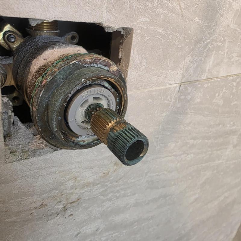 Shower valve cartridge with mineral buildup inside wall