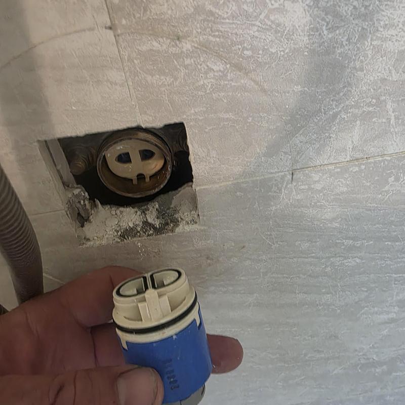 Shower cartridge removed for replacement in wall fixture